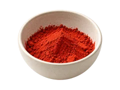 A ceramic bowl of red colorant powder, an editorial illustration for dyeing.