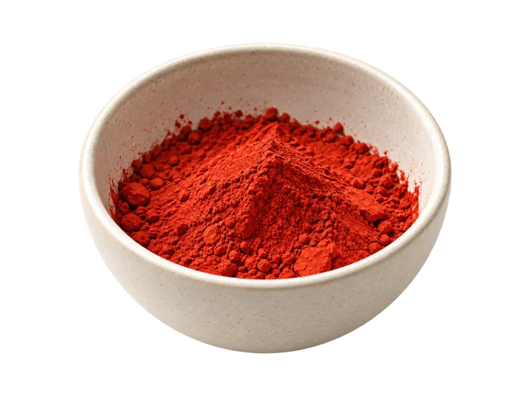 A ceramic bowl of red colorant powder, an editorial illustration for dyeing.