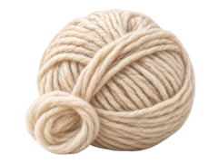 A ball of cream wool yarn with a loose strand.